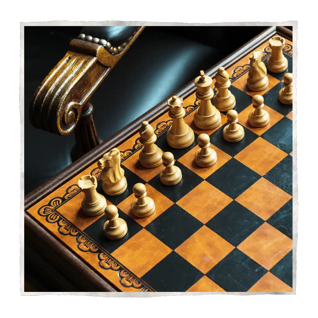 Old and classic chess board with chess pieces on it