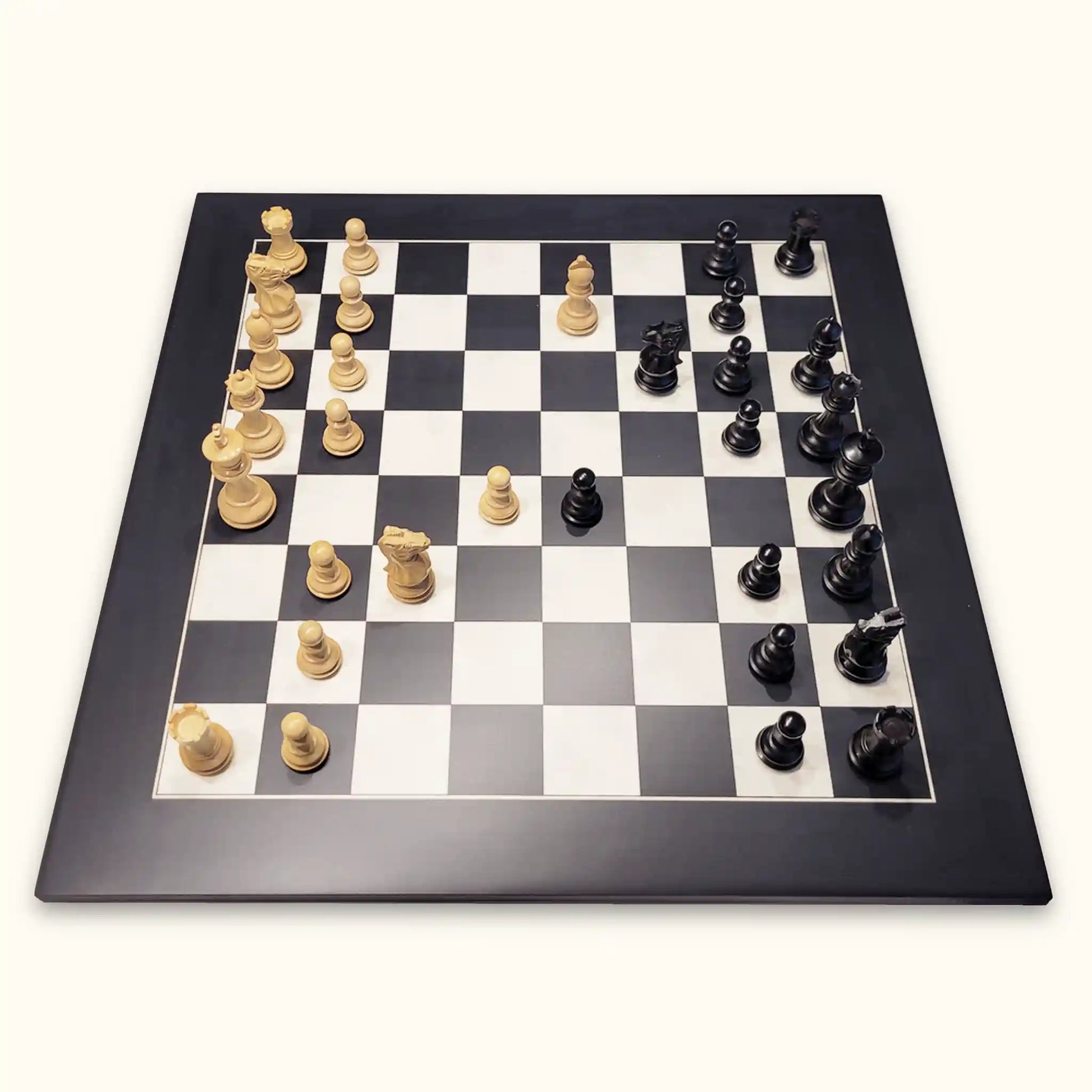 Chess pieces grace black on black chessboard side
